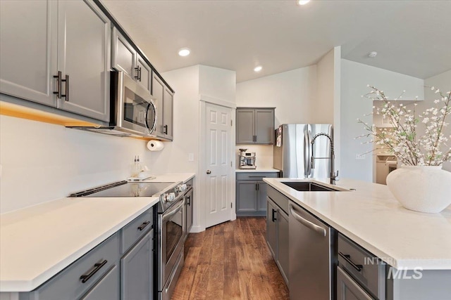 19558 Delmarva Ave, Caldwell, ID 83605 - kitchen with stainless steel appliances, gray cabinetry, dark wood finished floors, recessed lighting, and light countertops