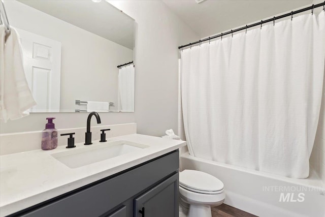19558 Delmarva Ave, Caldwell, ID 83605 - bathroom featuring vanity, shower / bathtub combination with curtain, and wood finished floors