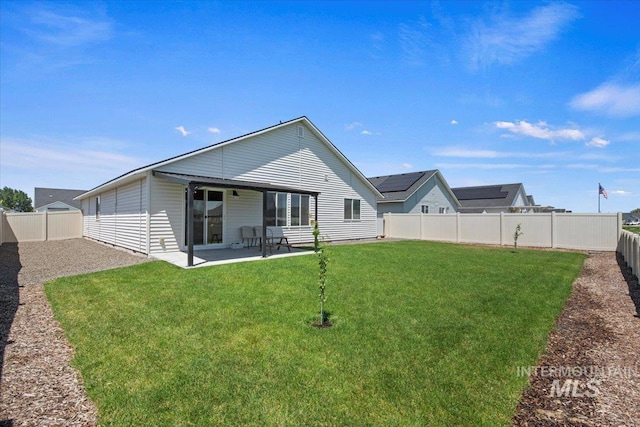 19558 Delmarva Ave, Caldwell, ID 83605 - back of property featuring a fenced backyard and a patio