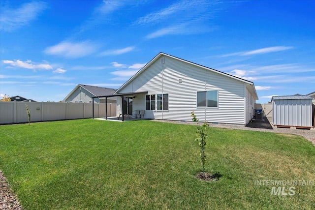 19558 Delmarva Ave, Caldwell, ID 83605 - back of house with a storage shed, a fenced backyard, and a patio