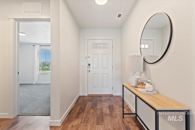 19558 Delmarva Ave, Caldwell, ID 83605 - doorway featuring dark wood-style floors and baseboards