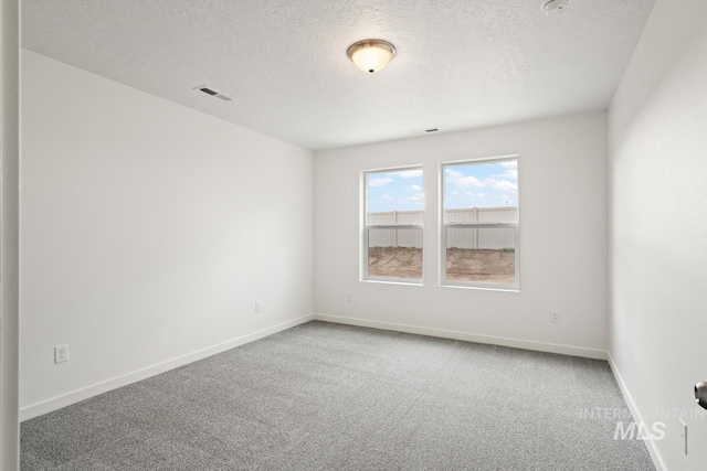 17892 Sunset Ridge Ave, Nampa, ID 83687 - carpeted empty room featuring baseboards, visible vents, and a textured ceiling