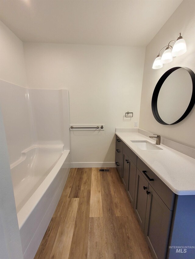 2350 Dorchester Ave, Burley, ID 83318 - bathroom with wood finished floors, vanity, and baseboards