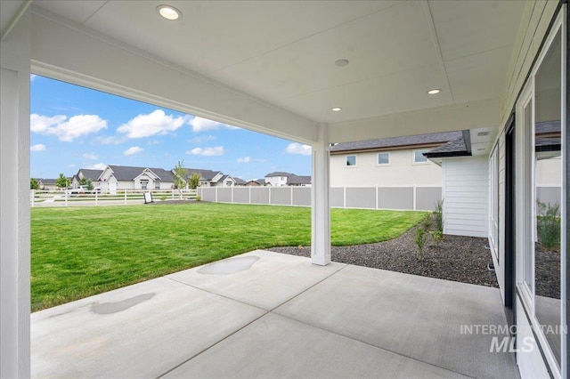 view of patio / terrace with a fenced backyard and a residential view