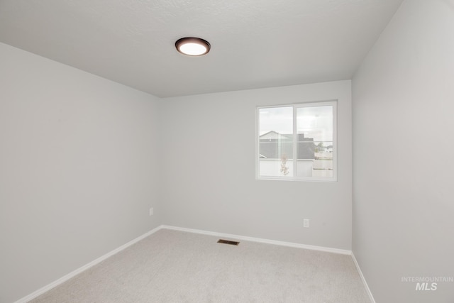 unfurnished room featuring carpet floors