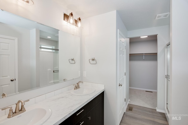 bathroom featuring vanity and wood-type flooring