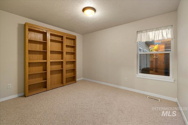 2920 S Givens Way, Meridian, ID 83642 - unfurnished room with carpet, a textured ceiling, and baseboards