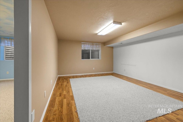 2920 S Givens Way, Meridian, ID 83642 - finished below grade area featuring a textured ceiling, wood finished floors, and baseboards