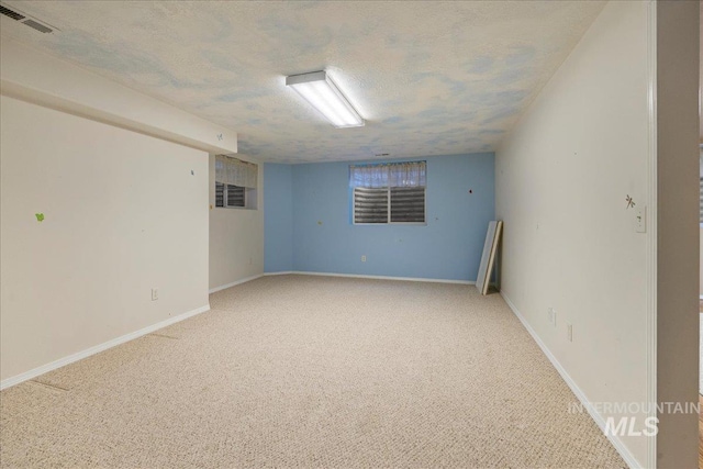 2920 S Givens Way, Meridian, ID 83642 - spare room with a textured ceiling, light carpet, and baseboards