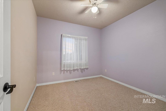 2920 S Givens Way, Meridian, ID 83642 - spare room featuring carpet flooring, ceiling fan, a textured ceiling, and baseboards