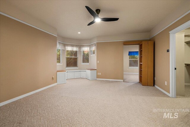 2920 S Givens Way, Meridian, ID 83642 - spare room featuring ceiling fan, light carpet, and baseboards