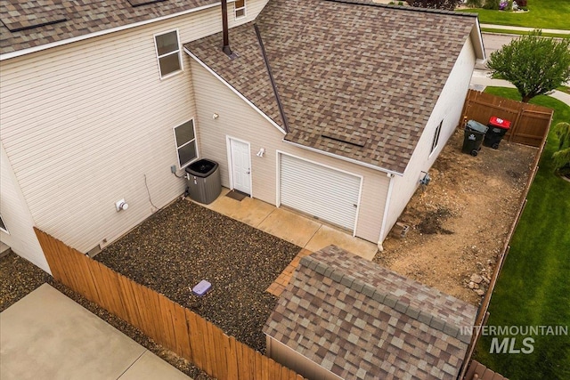2920 S Givens Way, Meridian, ID 83642 - view of side of property with a shingled roof, fence, and cooling unit