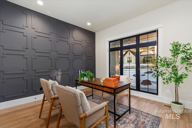 office featuring baseboards, recessed lighting, and light wood-style flooring