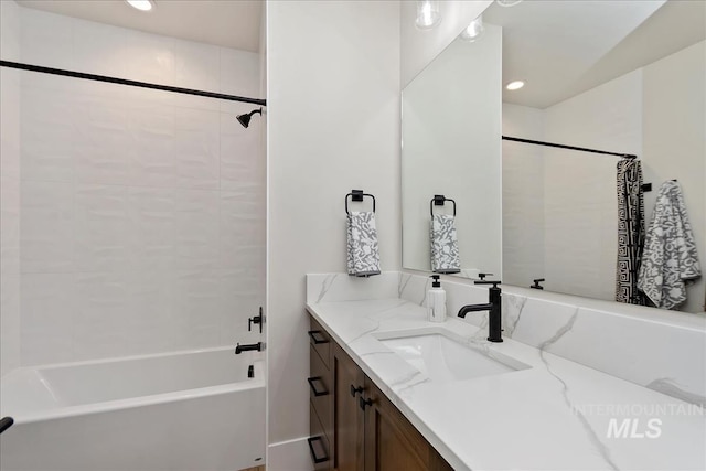 full bathroom with vanity, recessed lighting, and shower / bath combo
