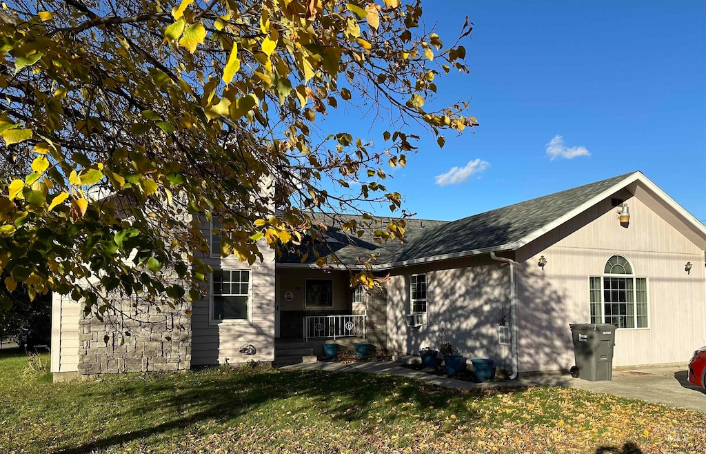 view of side of home featuring a yard