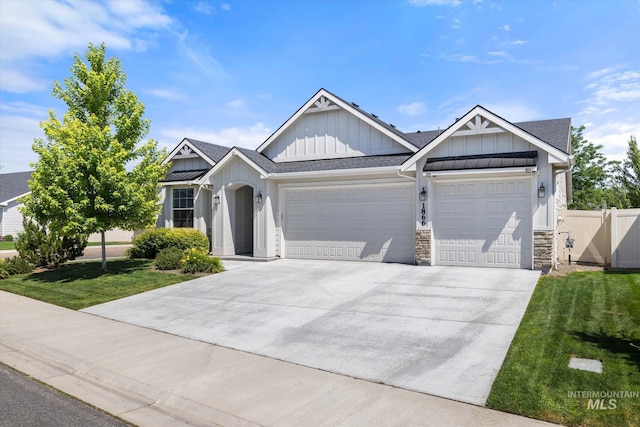 1866 W Windswept Dr, Meridian, ID 83646 - view of front facade featuring board and batten siding, an attached garage, concrete driveway, a shingled roof, and stone siding
