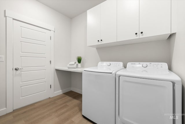 1866 W Windswept Dr, Meridian, ID 83646 - washroom with independent washer and dryer, cabinet space, and light wood-type flooring