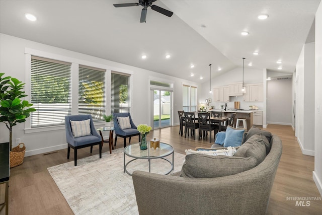 1866 W Windswept Dr, Meridian, ID 83646 - living area with a ceiling fan, light wood-type flooring, recessed lighting, and high vaulted ceiling