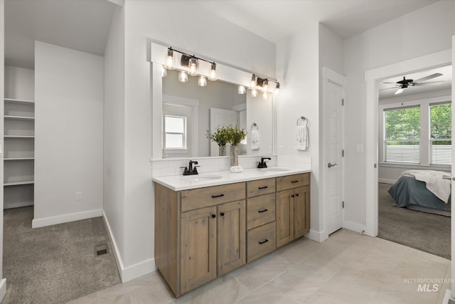 1866 W Windswept Dr, Meridian, ID 83646 - ensuite bathroom with double vanity, ceiling fan, and backsplash