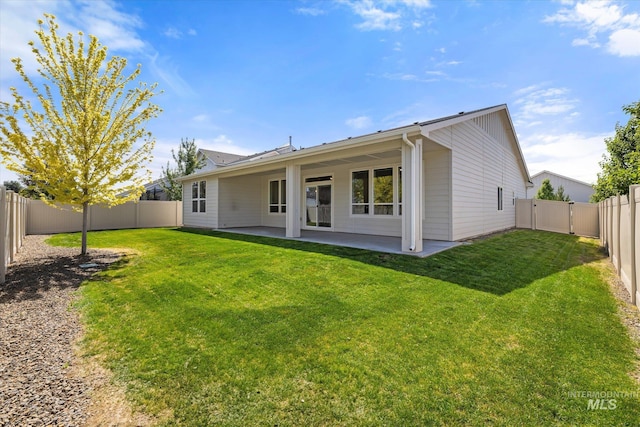 1866 W Windswept Dr, Meridian, ID 83646 - rear view of property with a fenced backyard and a patio