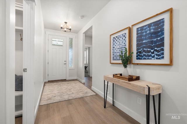 1866 W Windswept Dr, Meridian, ID 83646 - foyer featuring wood finished floors and a chandelier