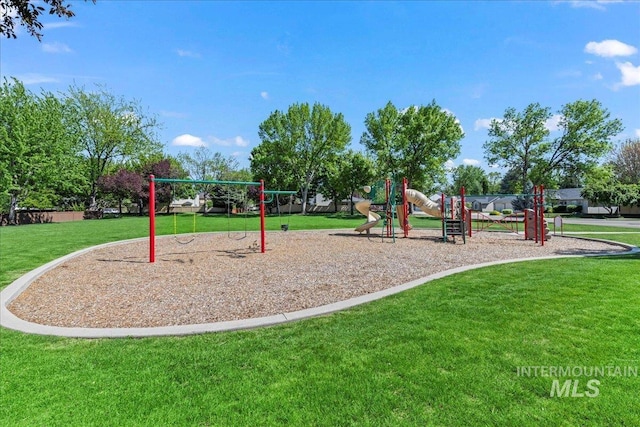 communal playground featuring a lawn