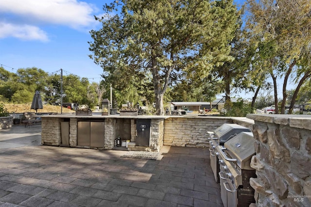 view of patio featuring exterior kitchen