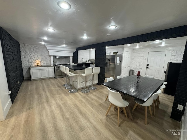 dining space featuring light hardwood / wood-style flooring