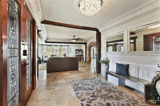 interior space featuring ornamental molding and a chandelier