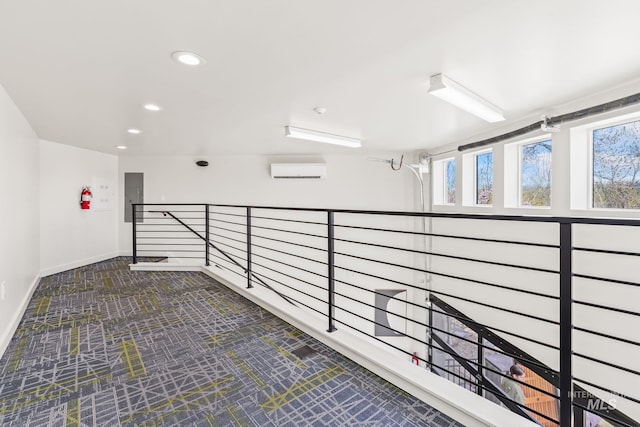 3472 N Prospect Ln, Garden City, ID 83714 - corridor featuring a wall unit AC, an upstairs landing, recessed lighting, baseboards, and electric panel