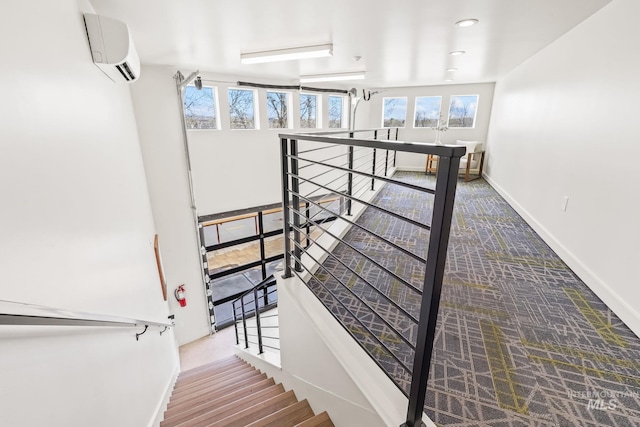 3472 N Prospect Ln, Garden City, ID 83714 - stairs featuring baseboards and a wall unit AC