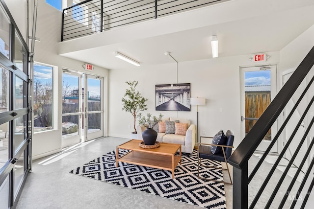 3472 N Prospect Ln, Garden City, ID 83714 - living area featuring concrete flooring and stairs