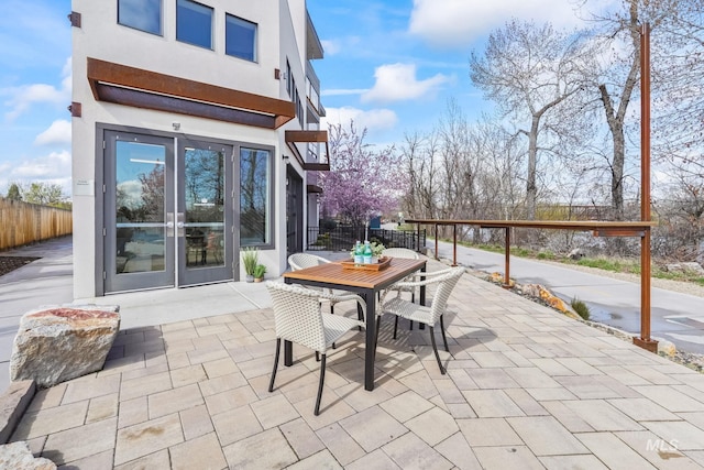 3472 N Prospect Ln, Garden City, ID 83714 - view of patio / terrace featuring french doors, outdoor dining area, and fence