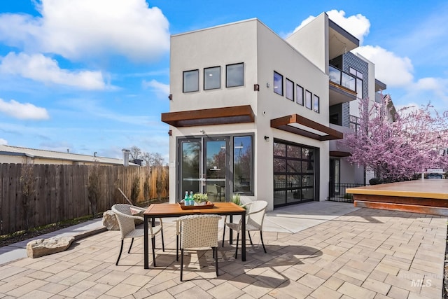 3472 N Prospect Ln, Garden City, ID 83714 - exterior space with outdoor dining area, stucco siding, fence, and a patio area