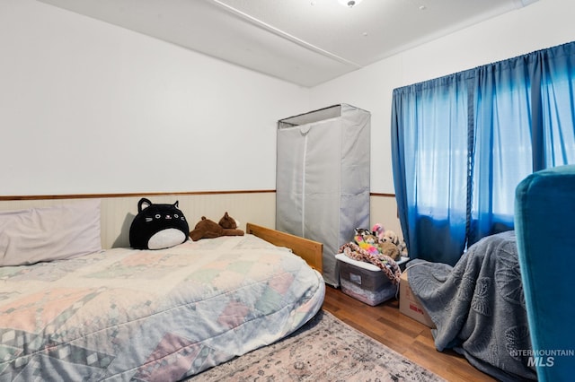 bedroom with wood finished floors