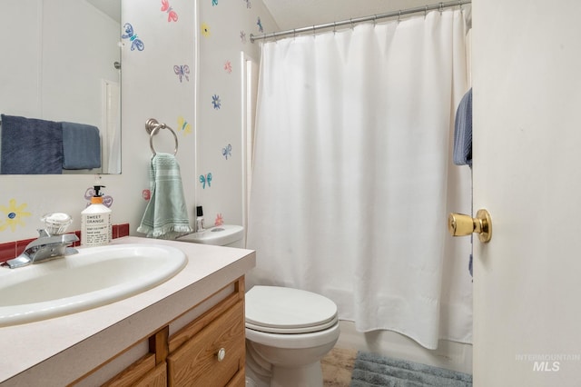 bathroom featuring toilet, vanity, and shower / bath combo with shower curtain