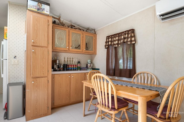dining room with a wall mounted AC, bar, crown molding, light floors, and lofted ceiling