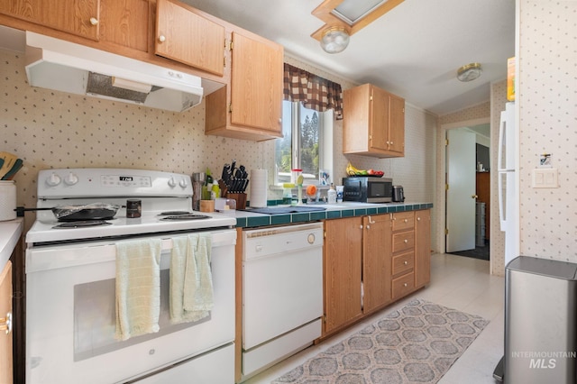 kitchen featuring white appliances, under cabinet range hood, wallpapered walls, tile counters, and decorative backsplash