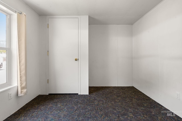 unfurnished bedroom featuring carpet