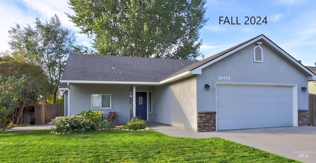 single story home featuring a garage, a porch, and a front lawn