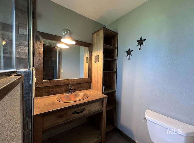 13974 Rustic Rd, Mccall, ID 83638 - bathroom with toilet, tasteful backsplash, and vanity