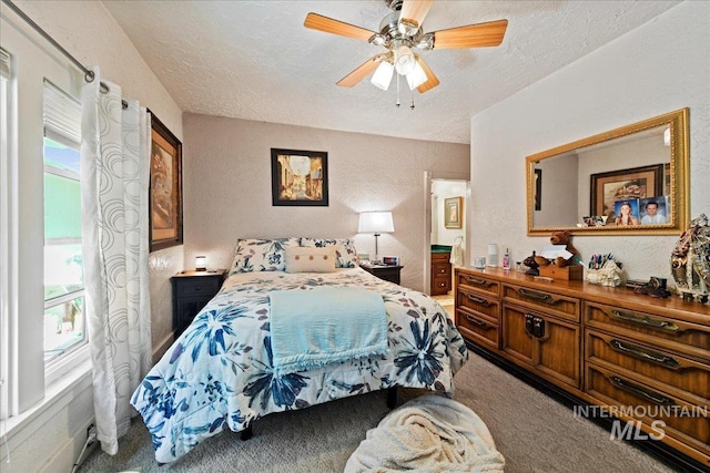 414 S 18th Ave, Caldwell, ID 83605 - carpeted bedroom featuring a textured ceiling, a textured wall, and ceiling fan
