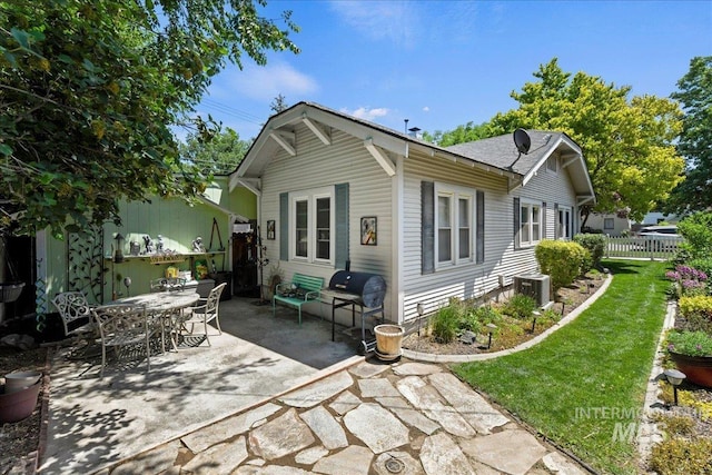 414 S 18th Ave, Caldwell, ID 83605 - rear view of house featuring a patio area and central AC