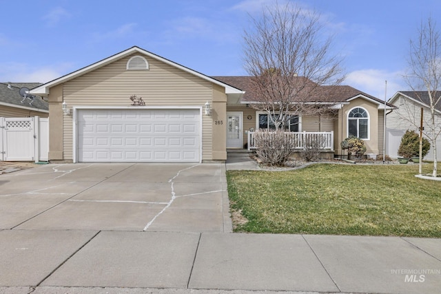 265 Cedar Park Cir, Twin Falls, ID 83301 - ranch-style home with a front yard, covered porch, a gate, and concrete driveway