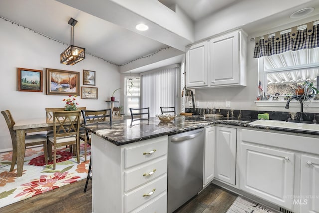 265 Cedar Park Cir, Twin Falls, ID 83301 - kitchen featuring a sink, white cabinetry, dishwasher, a peninsula, and dark wood-type flooring