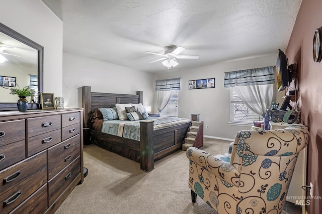 265 Cedar Park Cir, Twin Falls, ID 83301 - bedroom featuring light carpet, baseboards, ceiling fan, and a textured ceiling