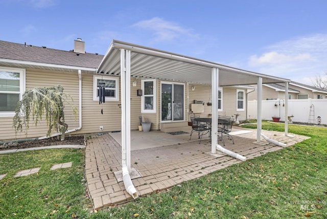 265 Cedar Park Cir, Twin Falls, ID 83301 - rear view of house featuring a patio area, a lawn, a chimney, and fence