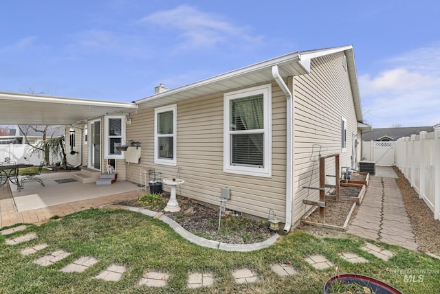 265 Cedar Park Cir, Twin Falls, ID 83301 - rear view of house with a patio area, entry steps, fence, and central AC