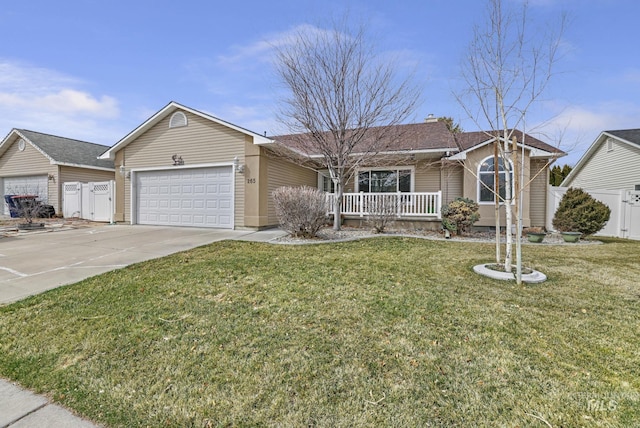 265 Cedar Park Cir, Twin Falls, ID 83301 - ranch-style house featuring driveway, a front yard, fence, an attached garage, and a porch