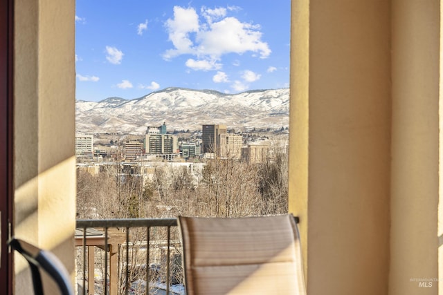 balcony featuring a view of city and a mountain view